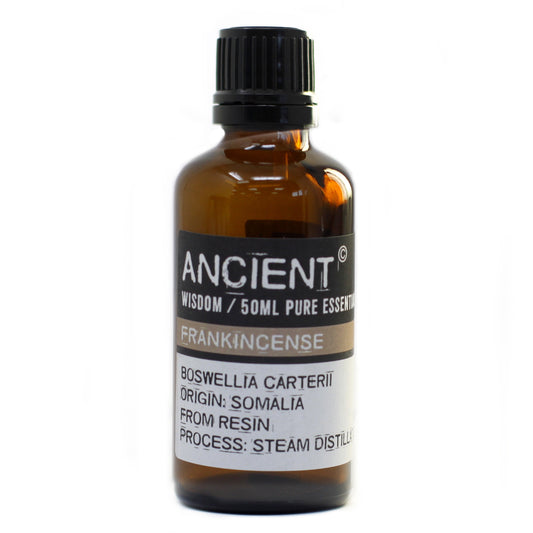 Bottle of frankincense essential oil with a white label on a white background