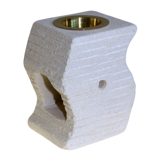 A collage of images displaying a white sandstone essential oil burner diffuser with brass and glass components, set against various backgrounds.