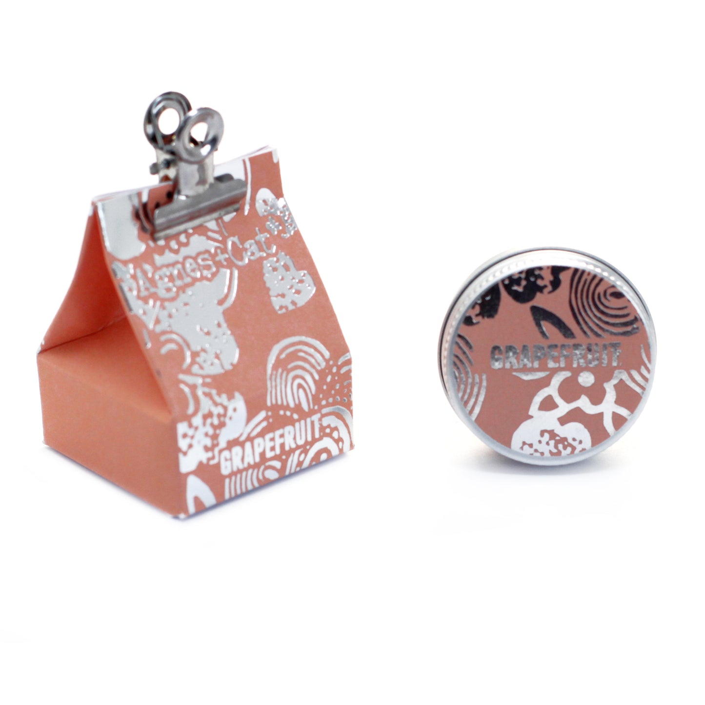 Agnes & Cat lip Balm, Small pink box with a clip and round decorative item featuring 'Grapefruit' text on a white background