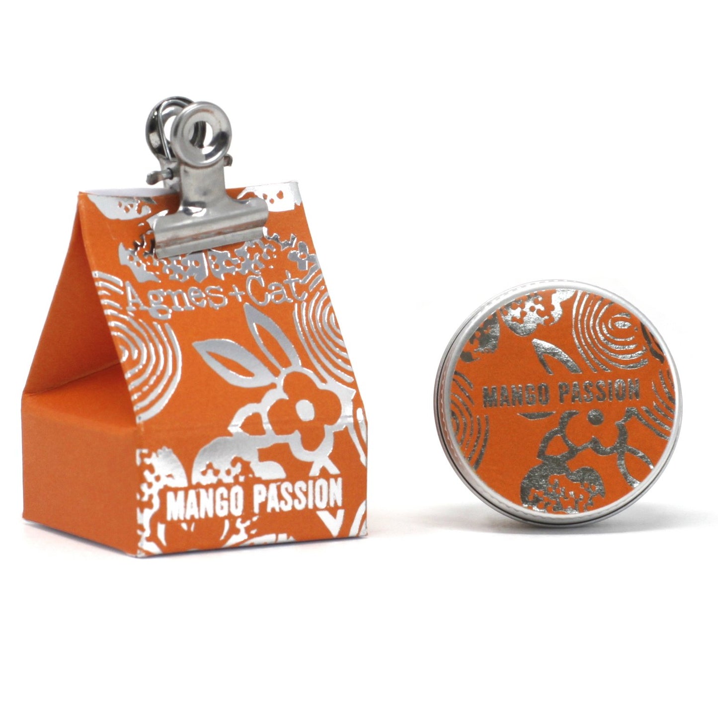 Agnes & Cat Lip Balm Orange and silver clip with 'Mango Passion' branding on a white background, uNderground Allure