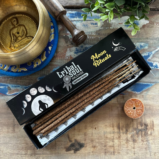 Box of Tribal Soul Moon Rituals Incense with incense sticks on a wooden surface with decorative items.