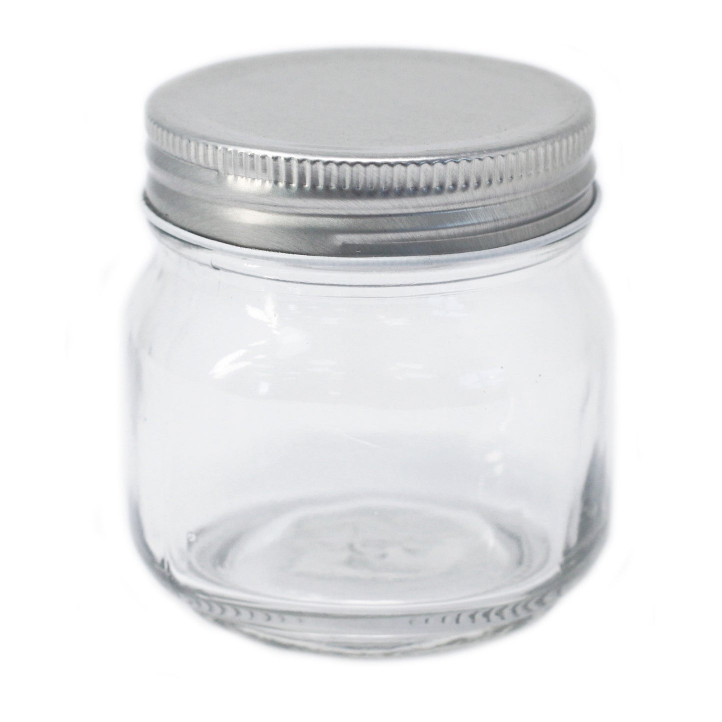 Clear glass jar with a metal lid on a white background