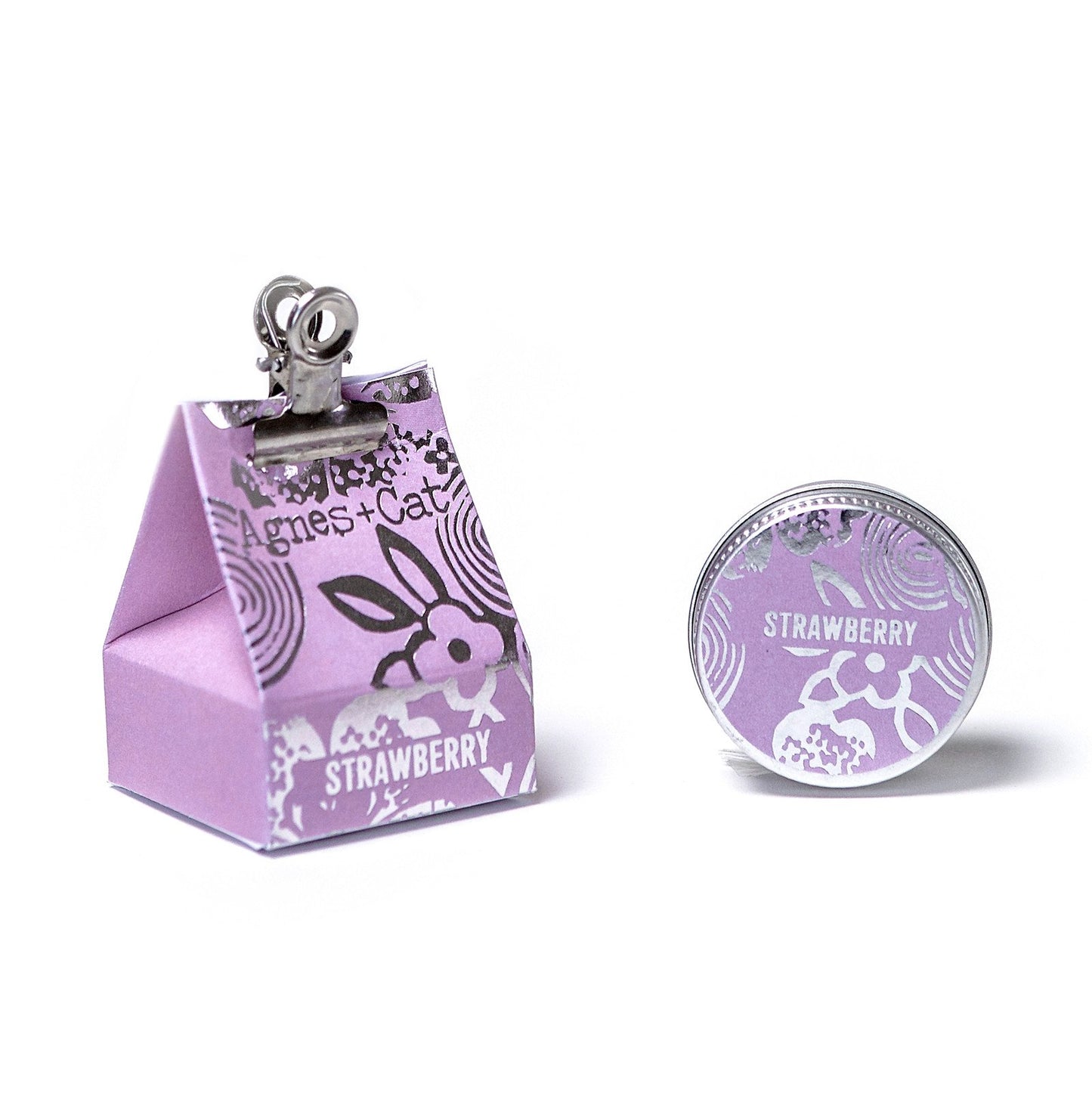 Agnes & Cat Lip balm, packaging with a clip and strawberry-themed design on a white background