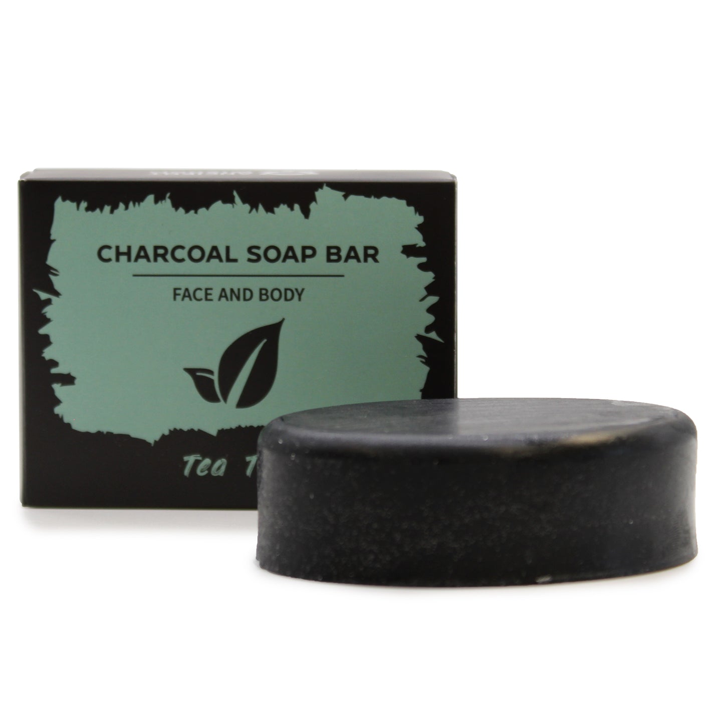 Black charcoal soap bar with a green and black packaging label on a white background