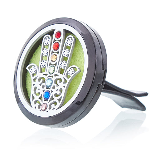 A stainless steel car diffuser kit with a green felt pad and a Hamsa design, including space for essential oil.Underground Allure, Essex UK