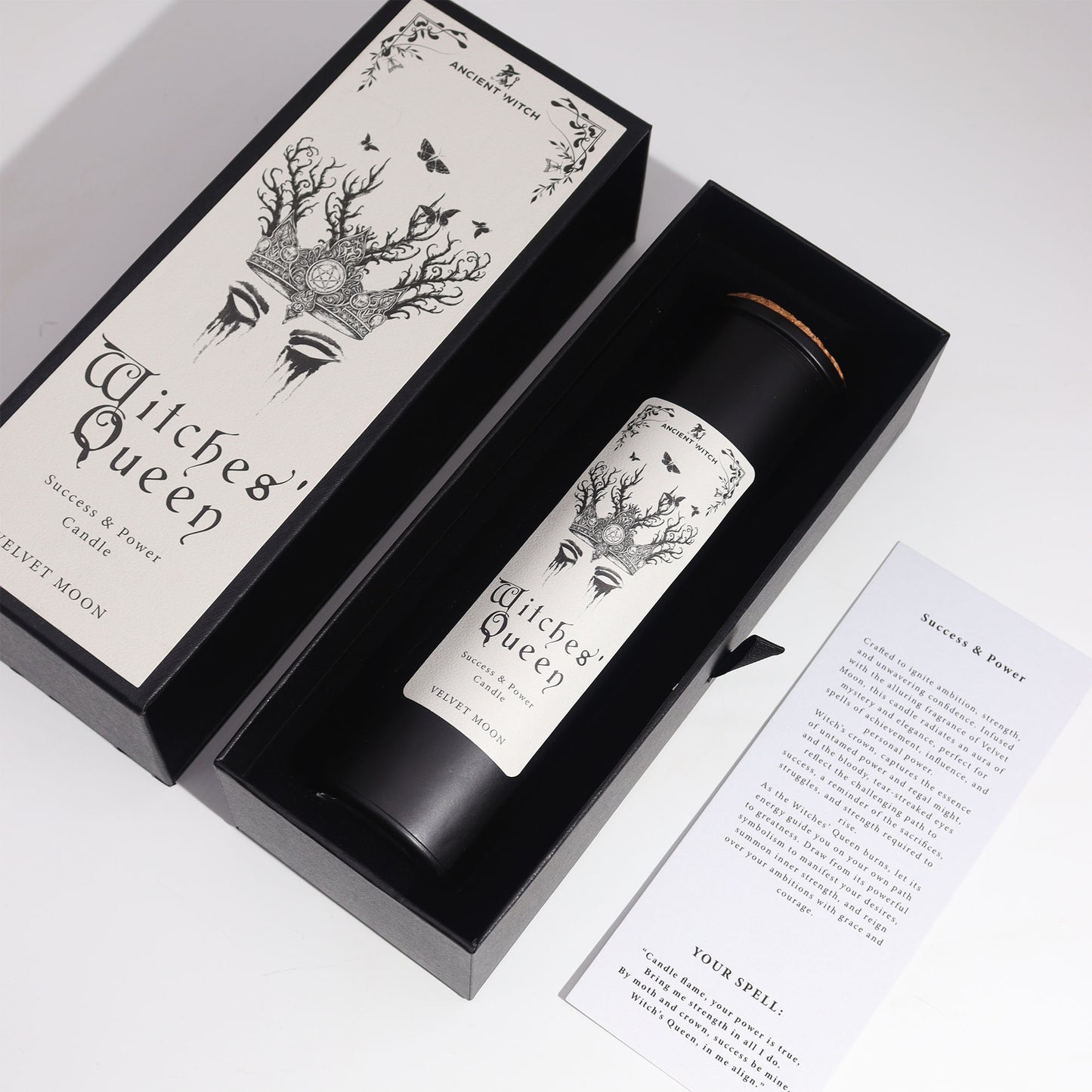 Witches' Queen candle in a black box with decorative design on a white background