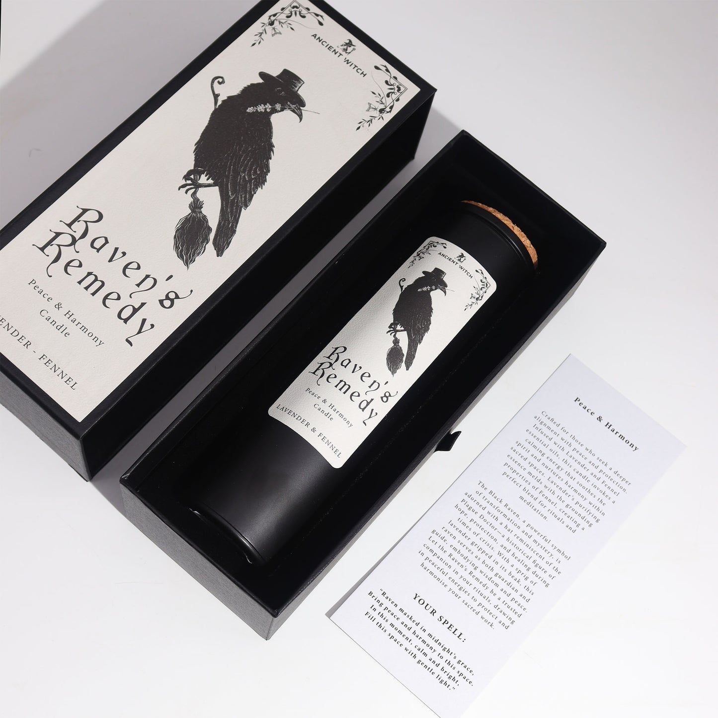 Candle labeled 'Raven's Remedy' in a decorative box and information card on a white background