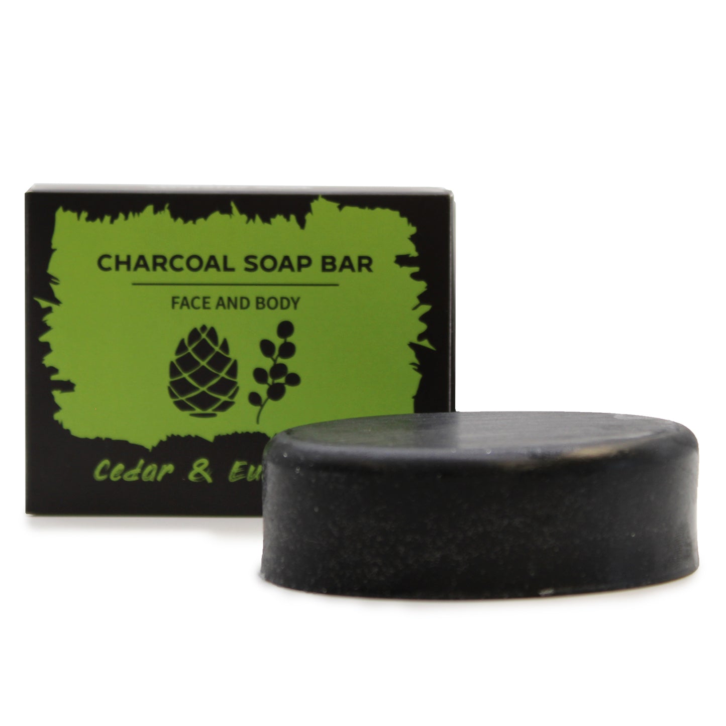 Charcoal soap bar with packaging labeled 'Cedar & Eucalyptus' on a white background