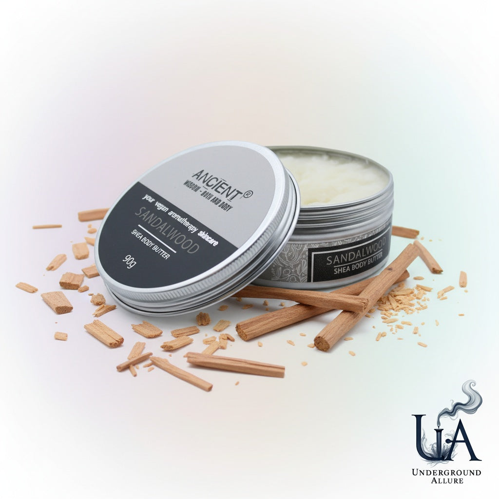 Two tins of sandalwood body butter with sandalwood pieces on a light background