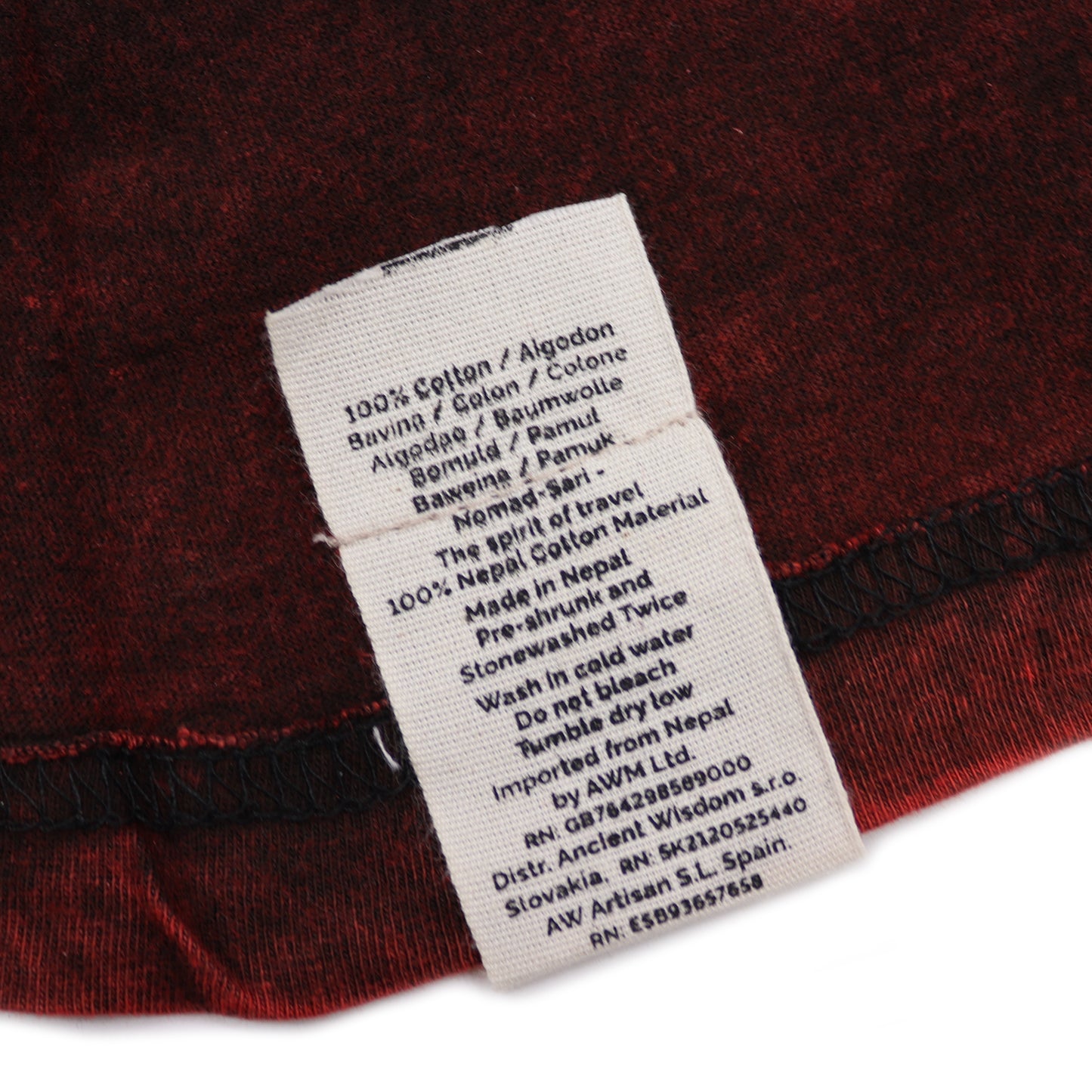 Clothing label on a red fabric background