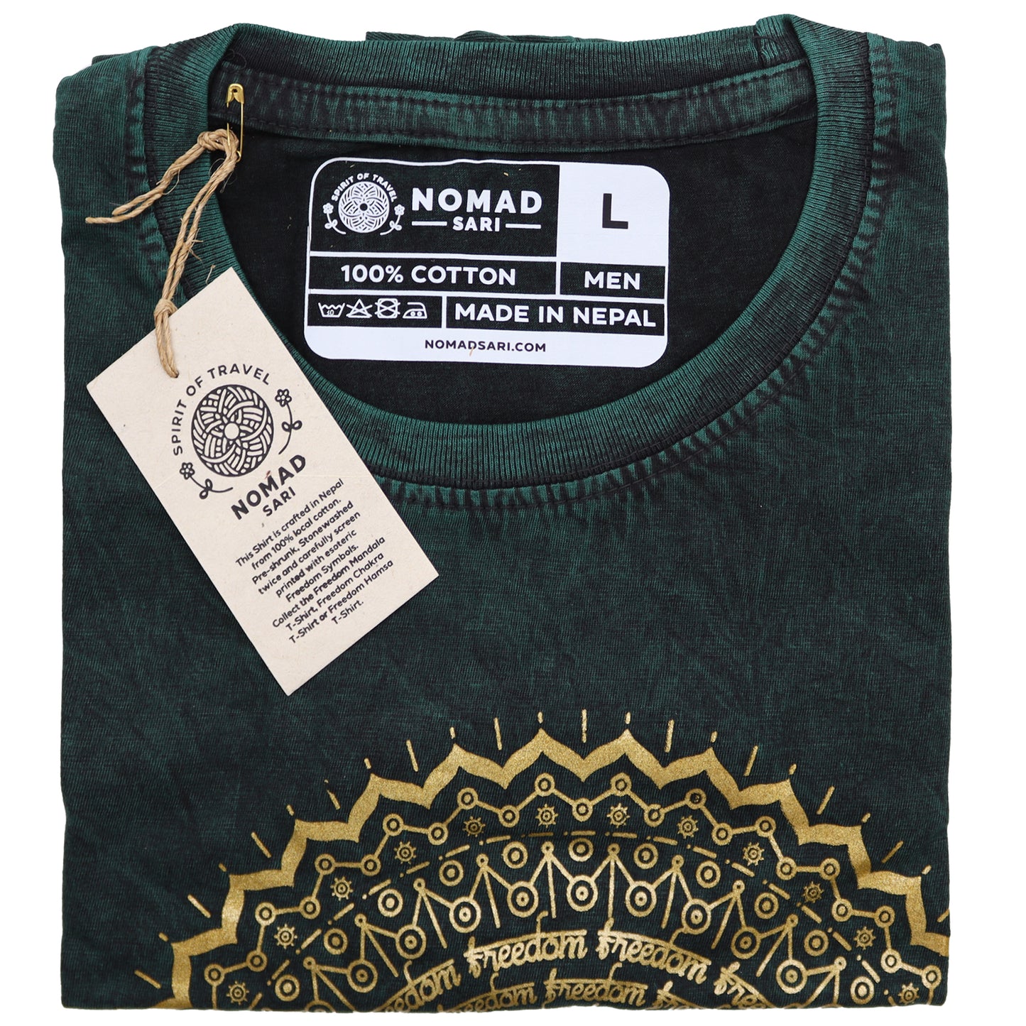 Folded green t-shirt with gold embroidery and 'Nomad Sari' label on a white background
