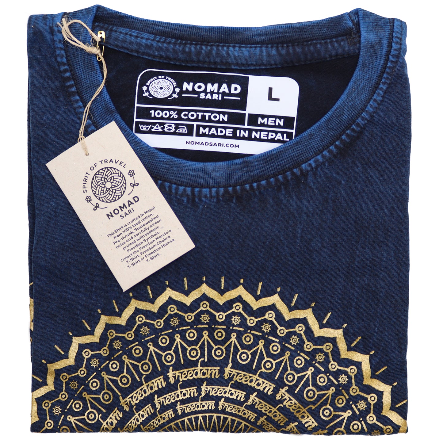 Folded blue shirt with gold patterns and a visible tag on a white background