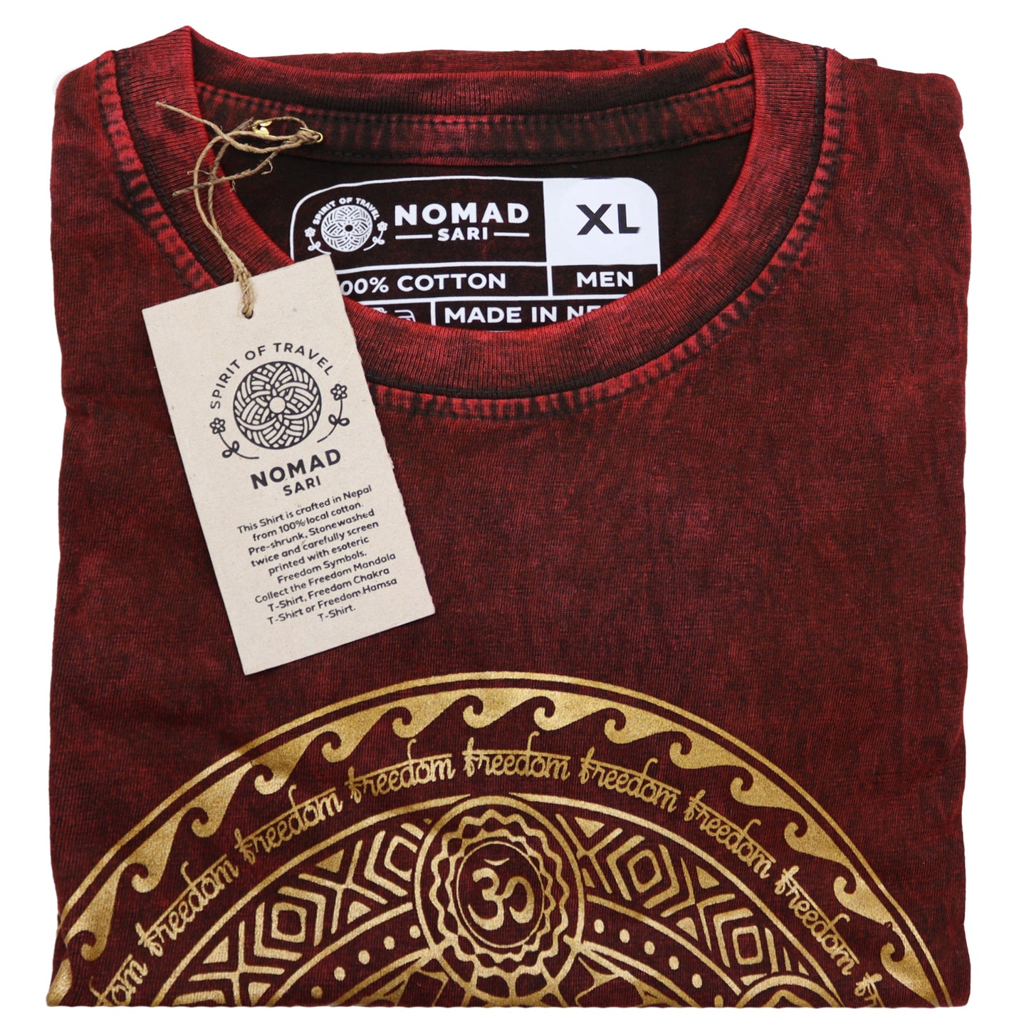 Folded maroon t-shirt with gold design and 'Nomad Sari' label on a white background