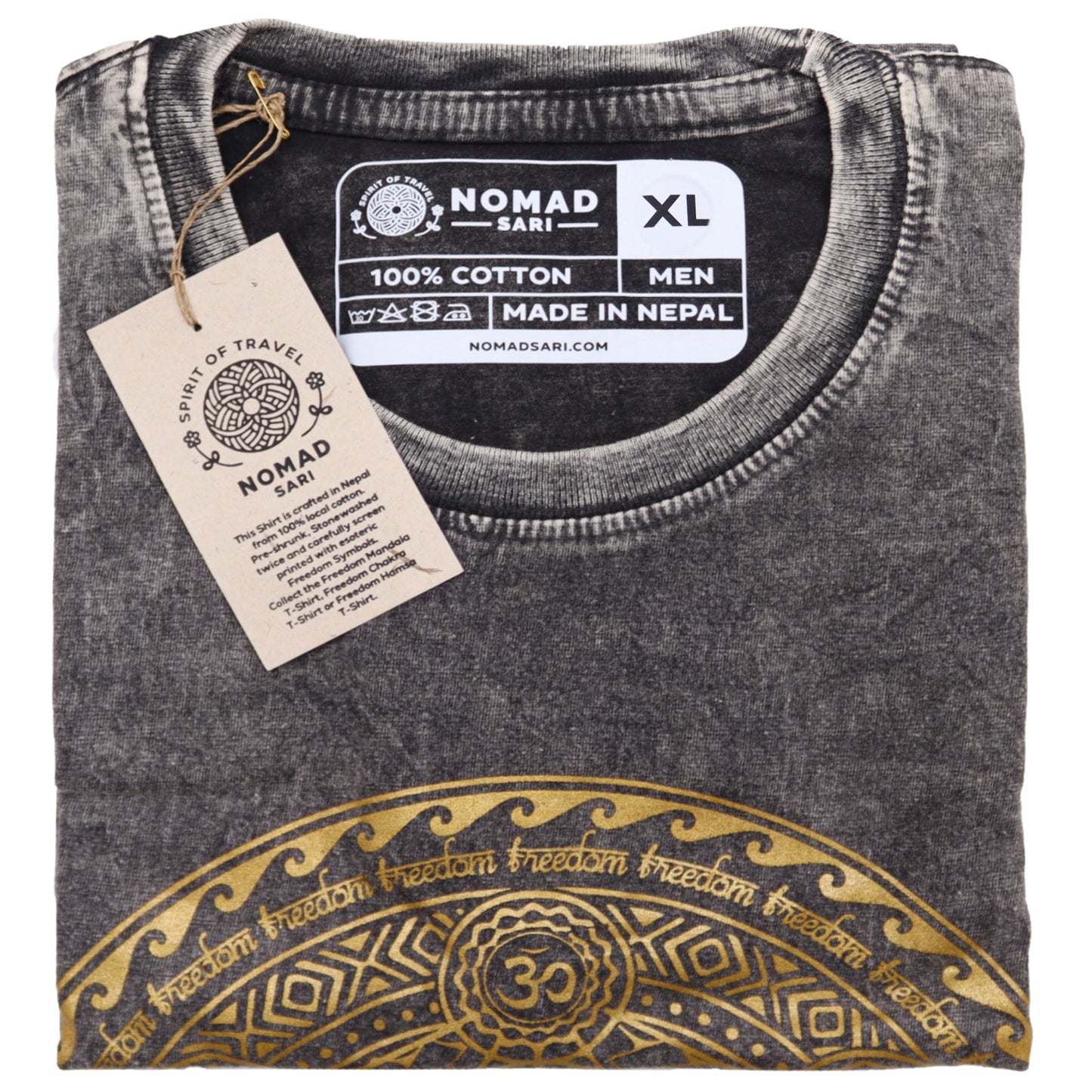 Folded gray t-shirt with gold design and Nomad Sari label on a white background