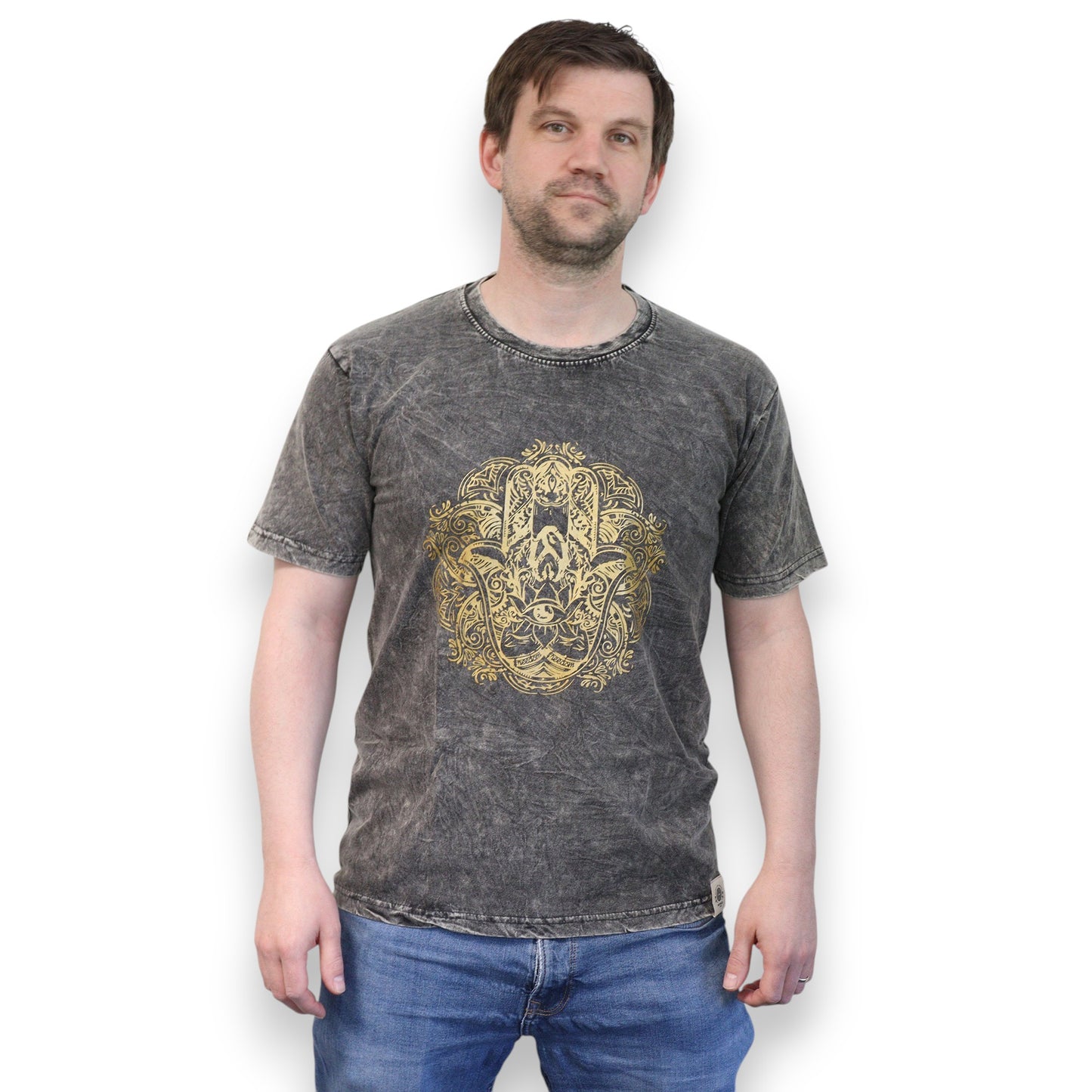 Man wearing a dark gray t-shirt with a gold hamsa graphic design on a white background