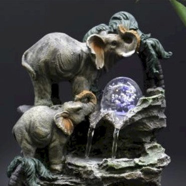 Tabletop Water Feature - 35cm - Elephants, Crystal Ball & Water Wheel water feature on a dark background