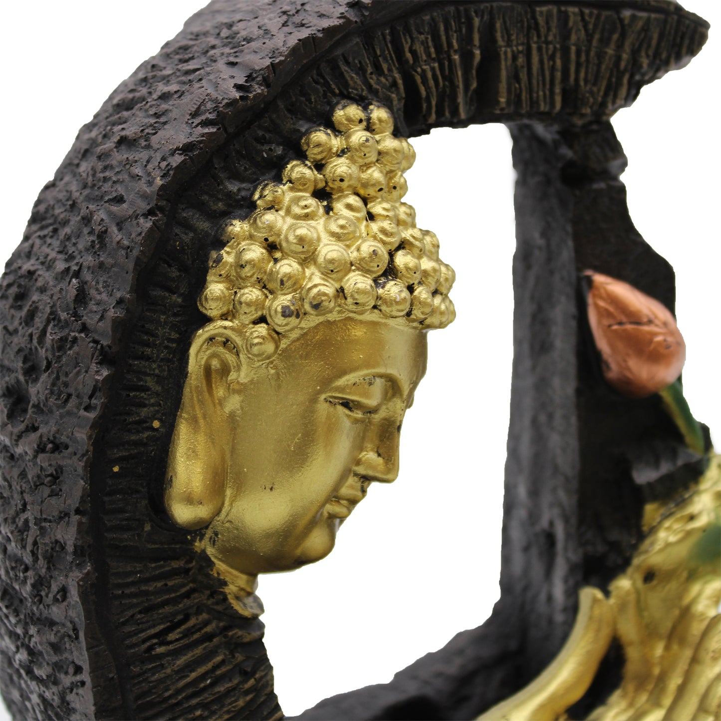 Close up Gold Buddha head sculpture with a black stone background