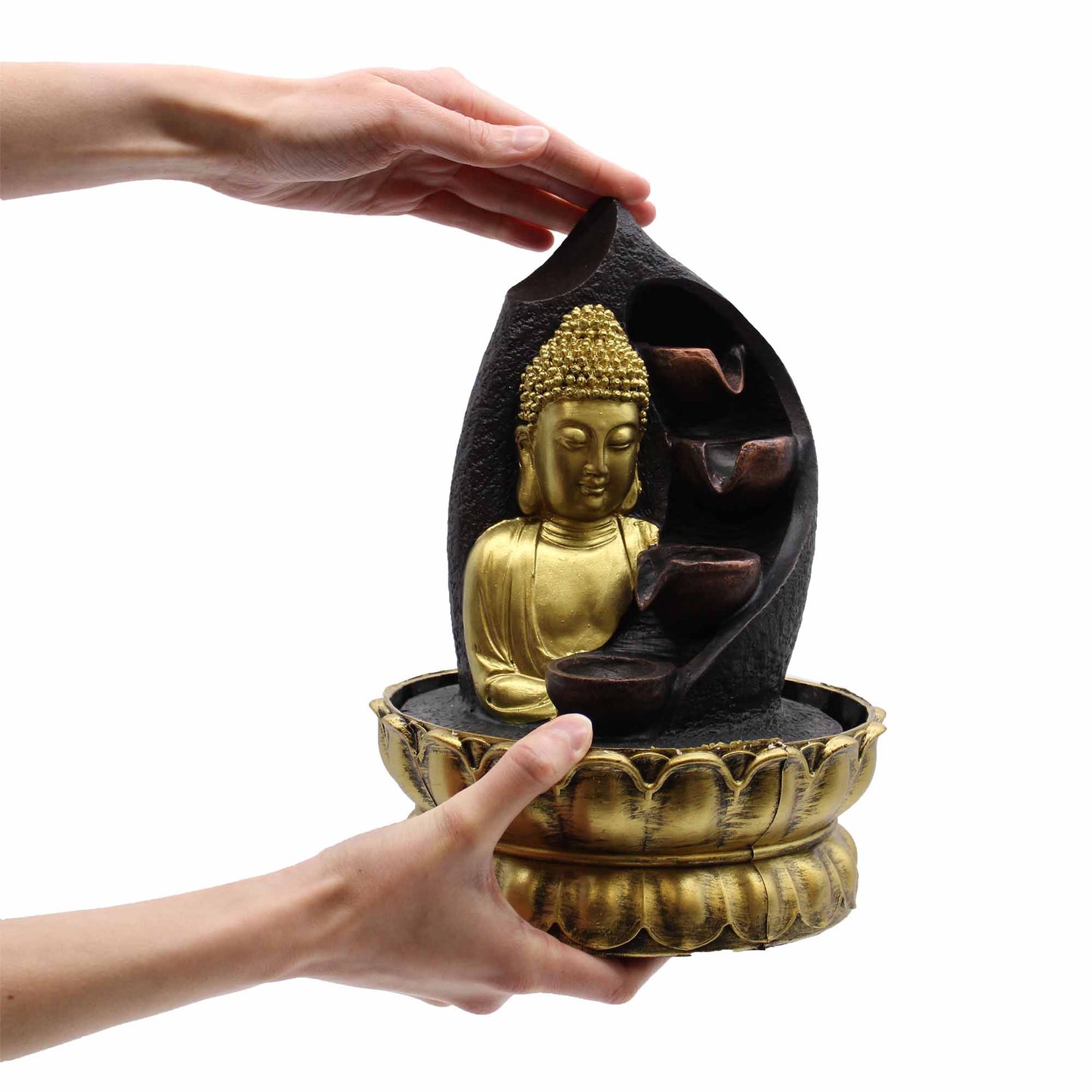 Tabletop Water Feature - 30cm - Golden Meditating Buddha figure held by a hand on a white background