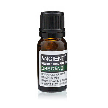 Bottle of oregano essential oil with a black cap on a white background