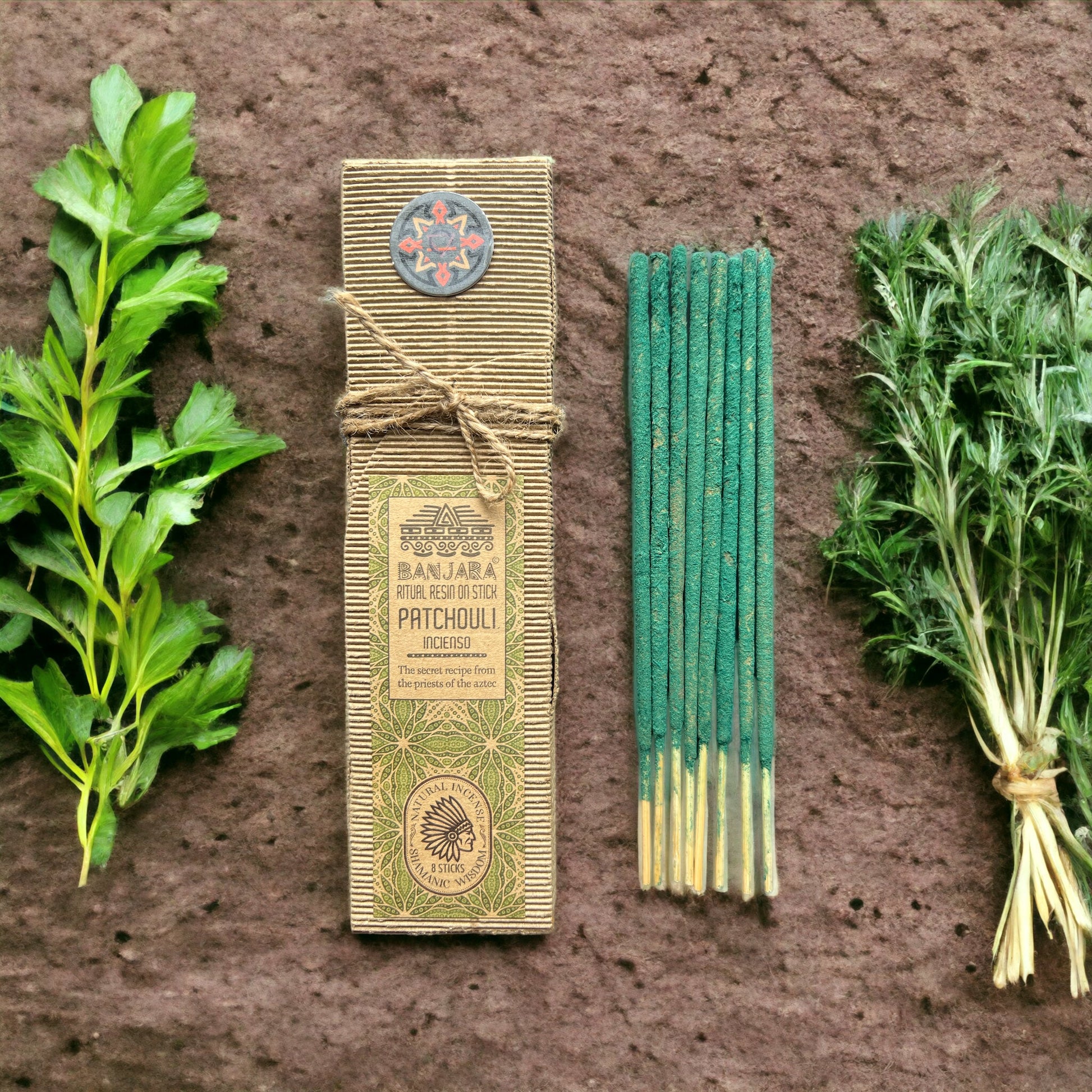 banjara packaging and incense sticks on a brown background and plants
