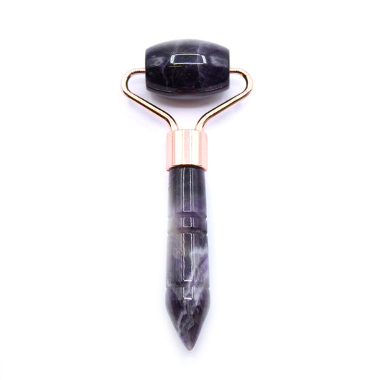 Gua Sha tool with Amethyst gold handle on a white background