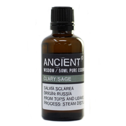 Bottle of clary sage essential oil with a black cap on a white background