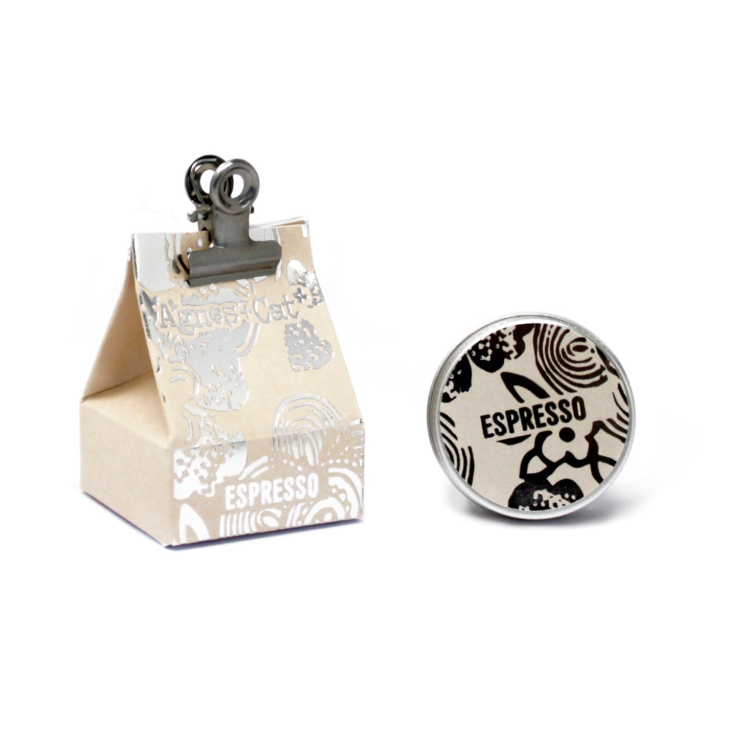 Small beige box with 'Espresso' Lip Balm and a round badge with similar design on a white background