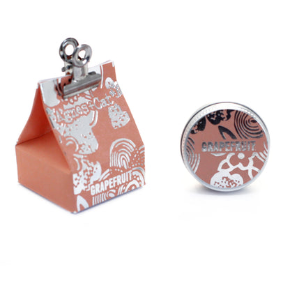 Agnes & Cat lip Balm, Small pink box with a clip and round decorative item featuring 'Grapefruit' text on a white background