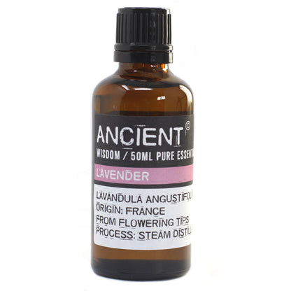 Bottle of lavender essential oil with a black cap on a white background