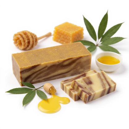 Bar of soap with honeycomb, honey, and leaves on a white background