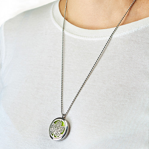 leaf diffuser necklace hanging around the neck