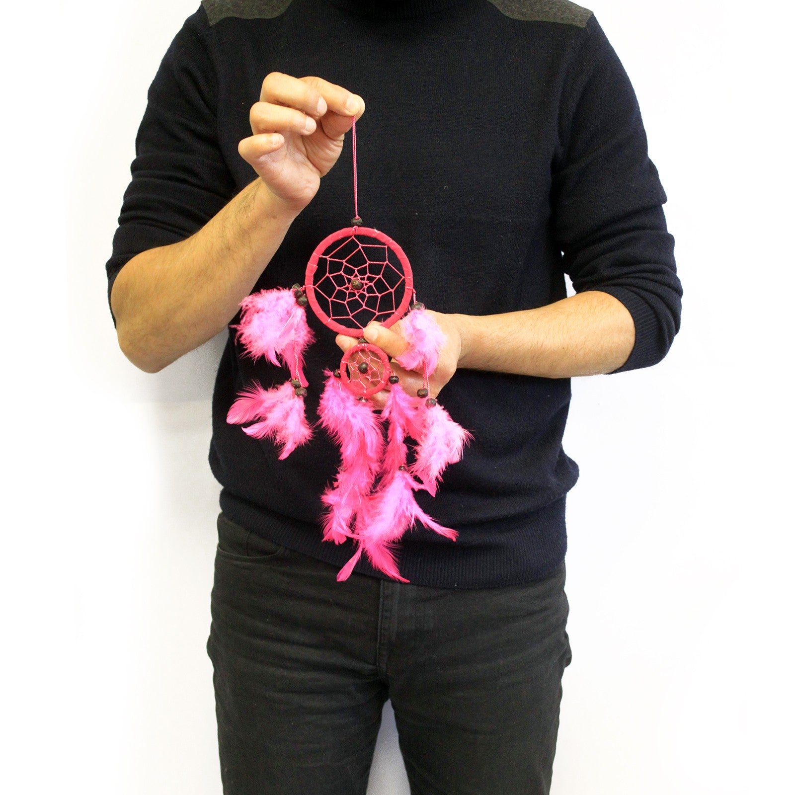 man holding a dreamcatcher