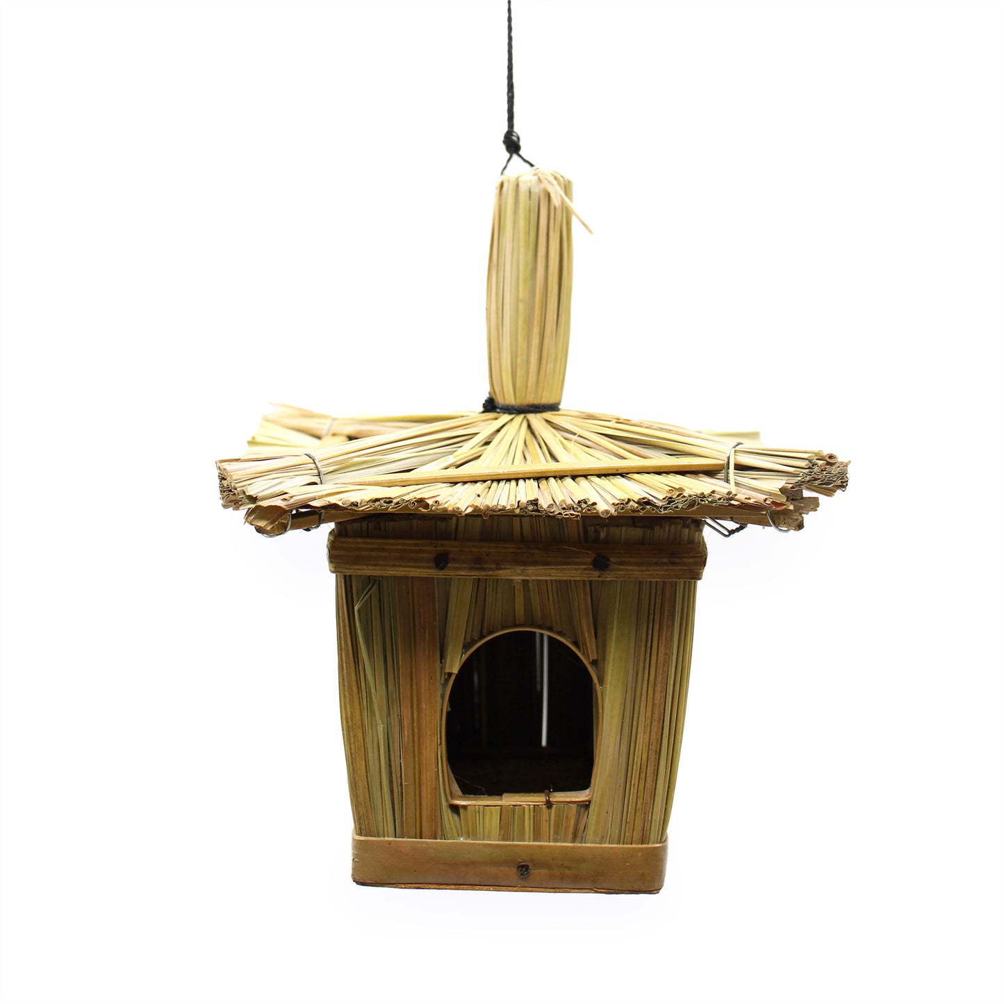 Bamboo birdhouse with thatched roof on a white background