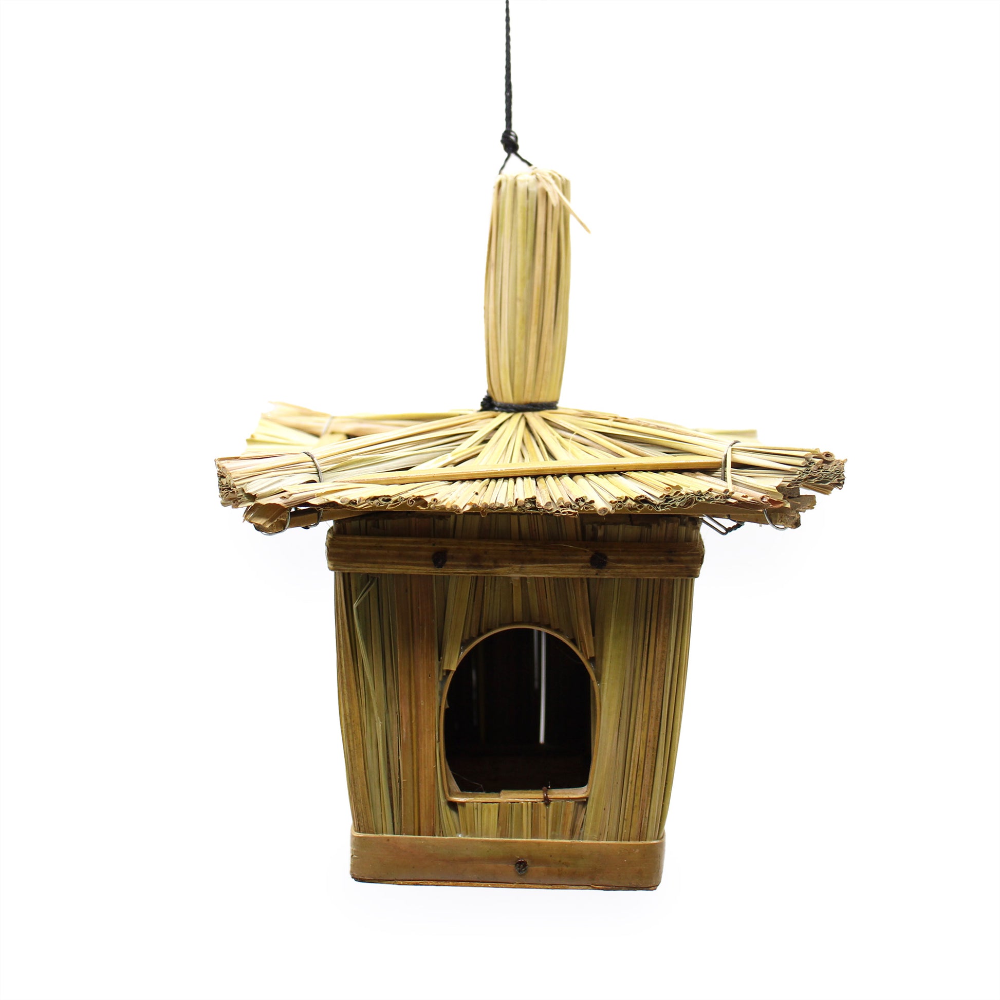 Bamboo birdhouse with thatched roof on a white background