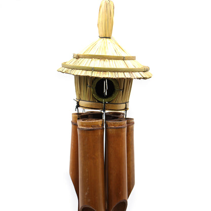 close up Bamboo wind chime with a pagoda-style Bird house top on a white background