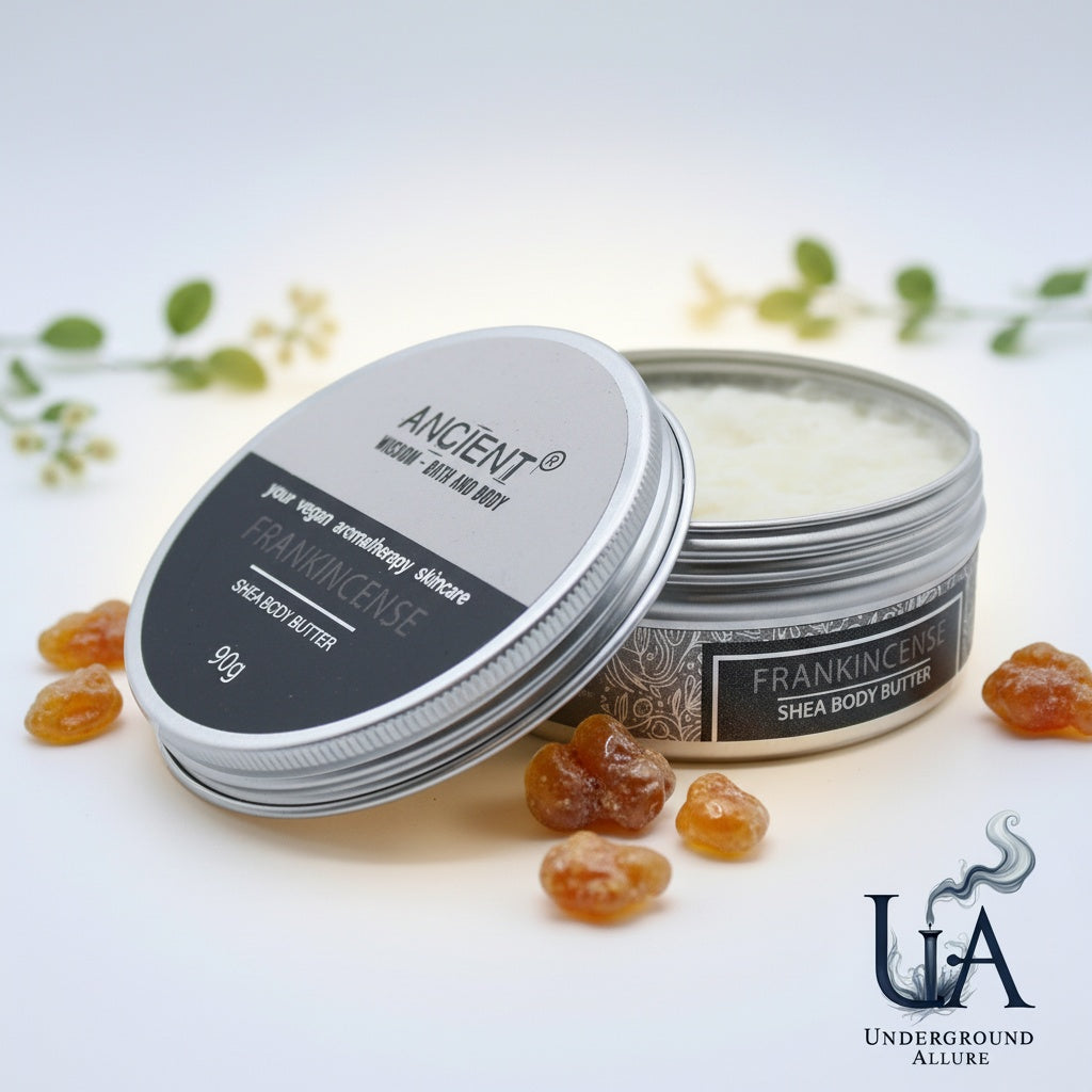 Shea body butter container with frankincense resin on a light background