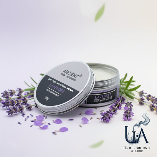 Two containers of lavender shea body butter with lavender flowers on a white background