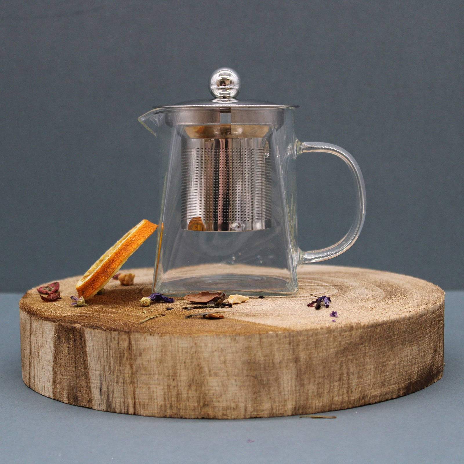 sitting on a wooden display plate -Glass Infuser Teapot - Tower Shape - 350ml