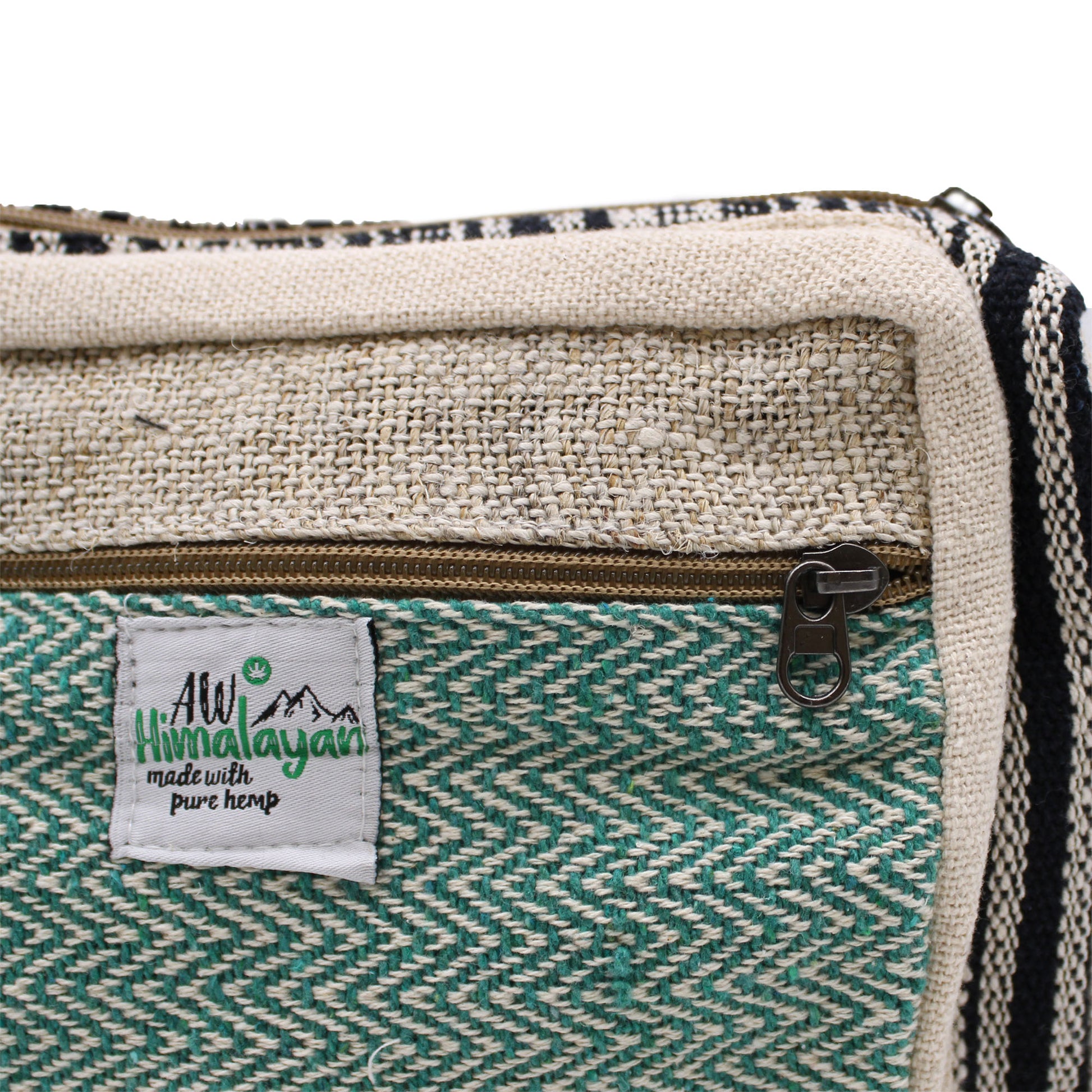 Close-up of a green and beige fabric product with a visible label on a white background