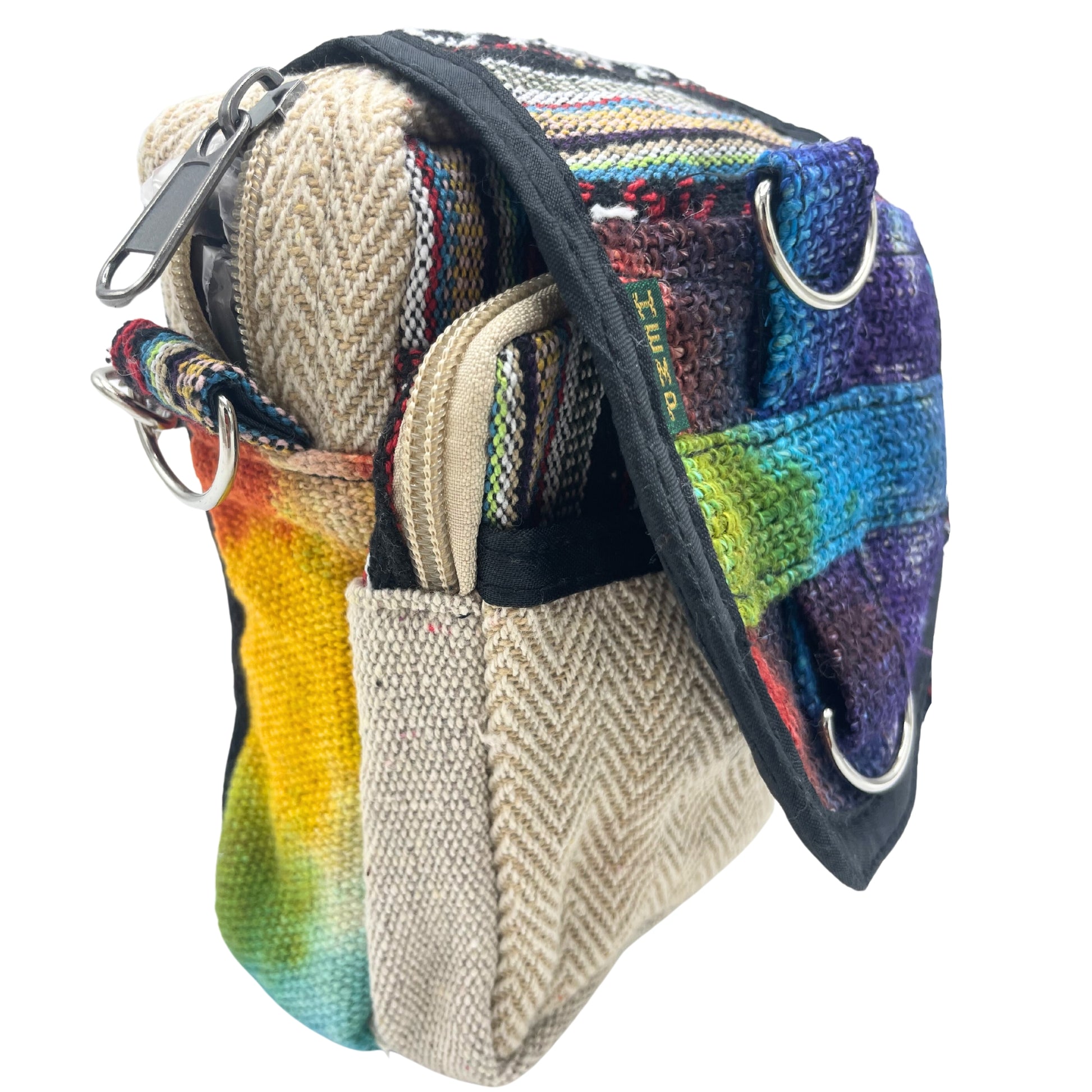 Multicolored fabric bag with a textured strap on a white background