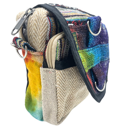 Multicolored fabric bag with a textured strap on a white background