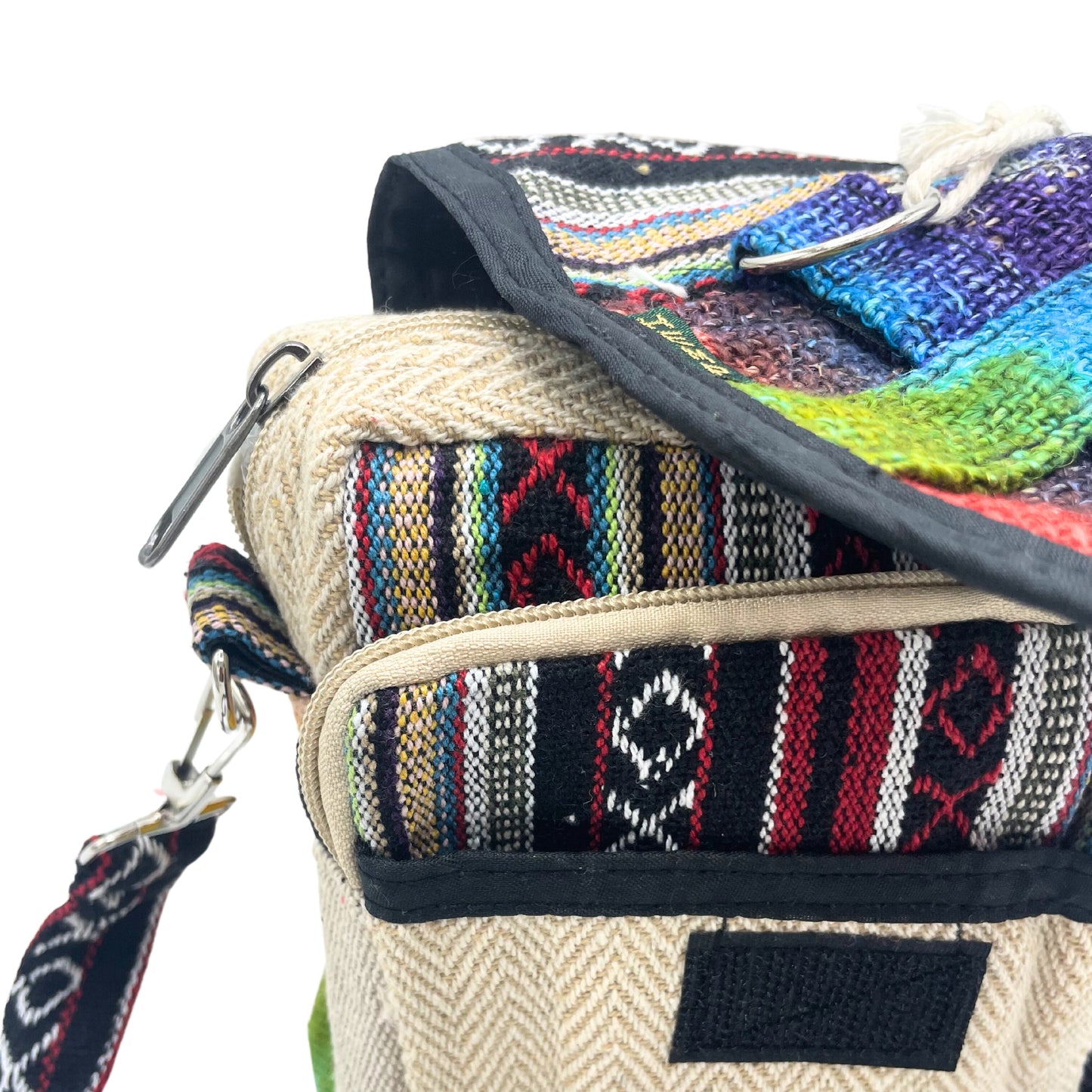 Multicolored woven bag with a strap on a white background