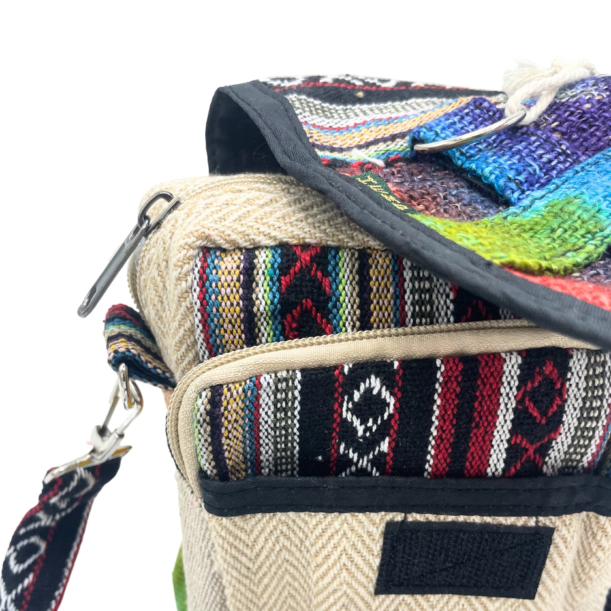 Multicolored woven bag with a strap on a white background