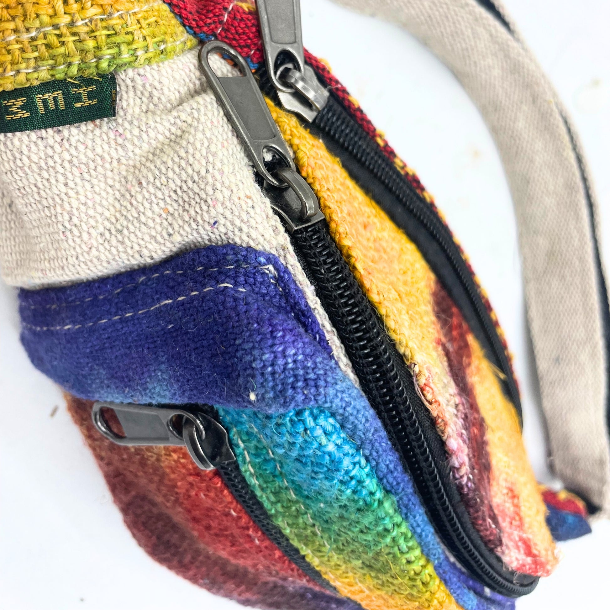 Colorful striped bag with a zipper on a white background