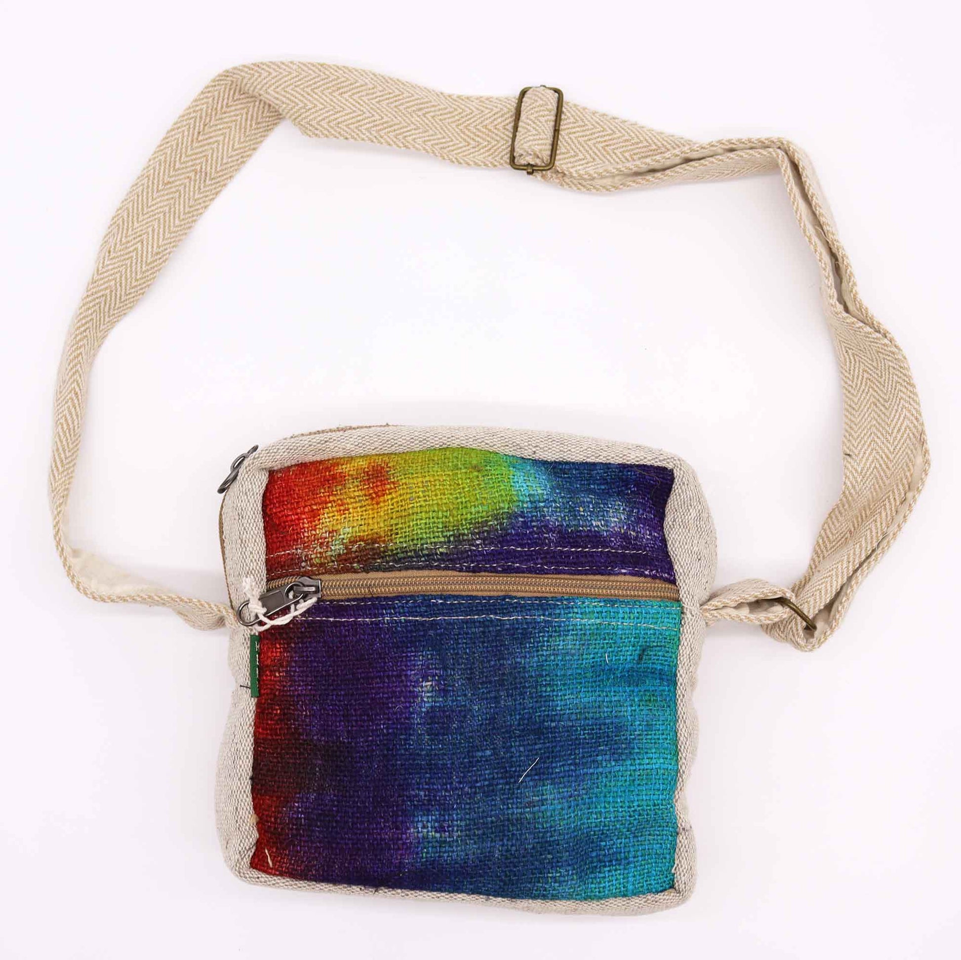 Multicolored tie-dye bag with a beige strap on a white background