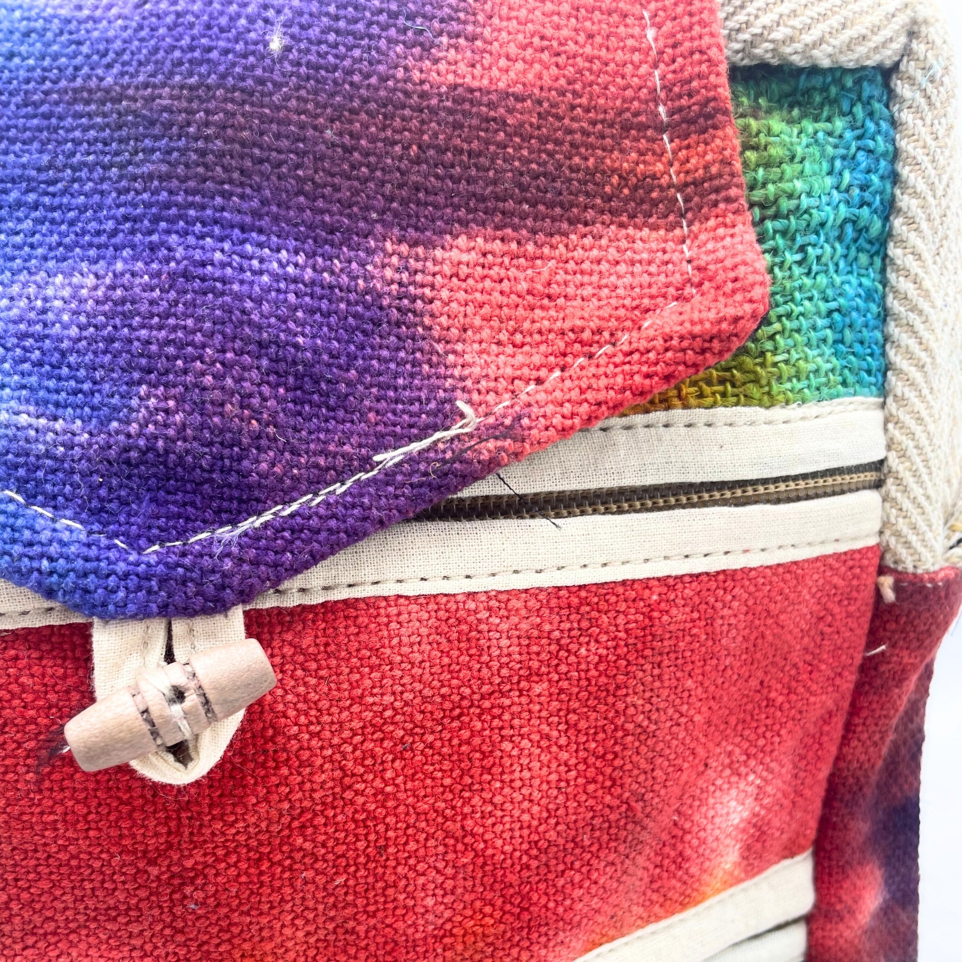 Close-up of a colorful fabric pouch with a zipper.