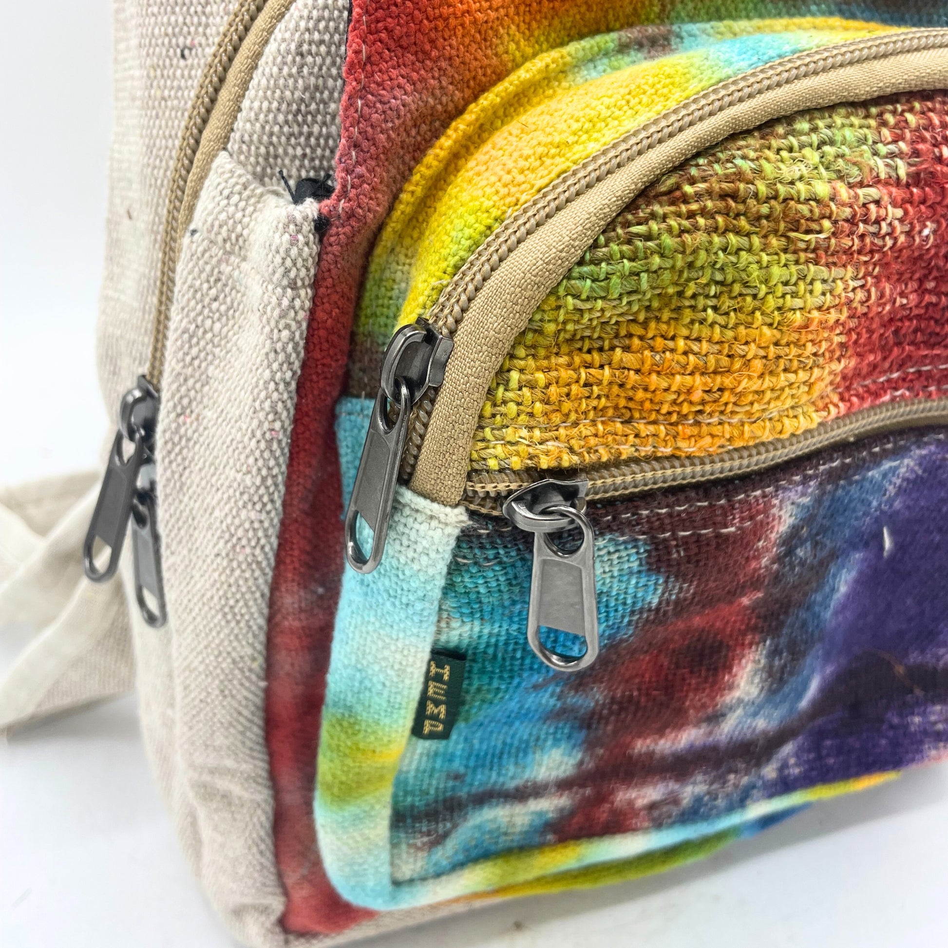 Colorful textured pouch with a visible brand label on a white background