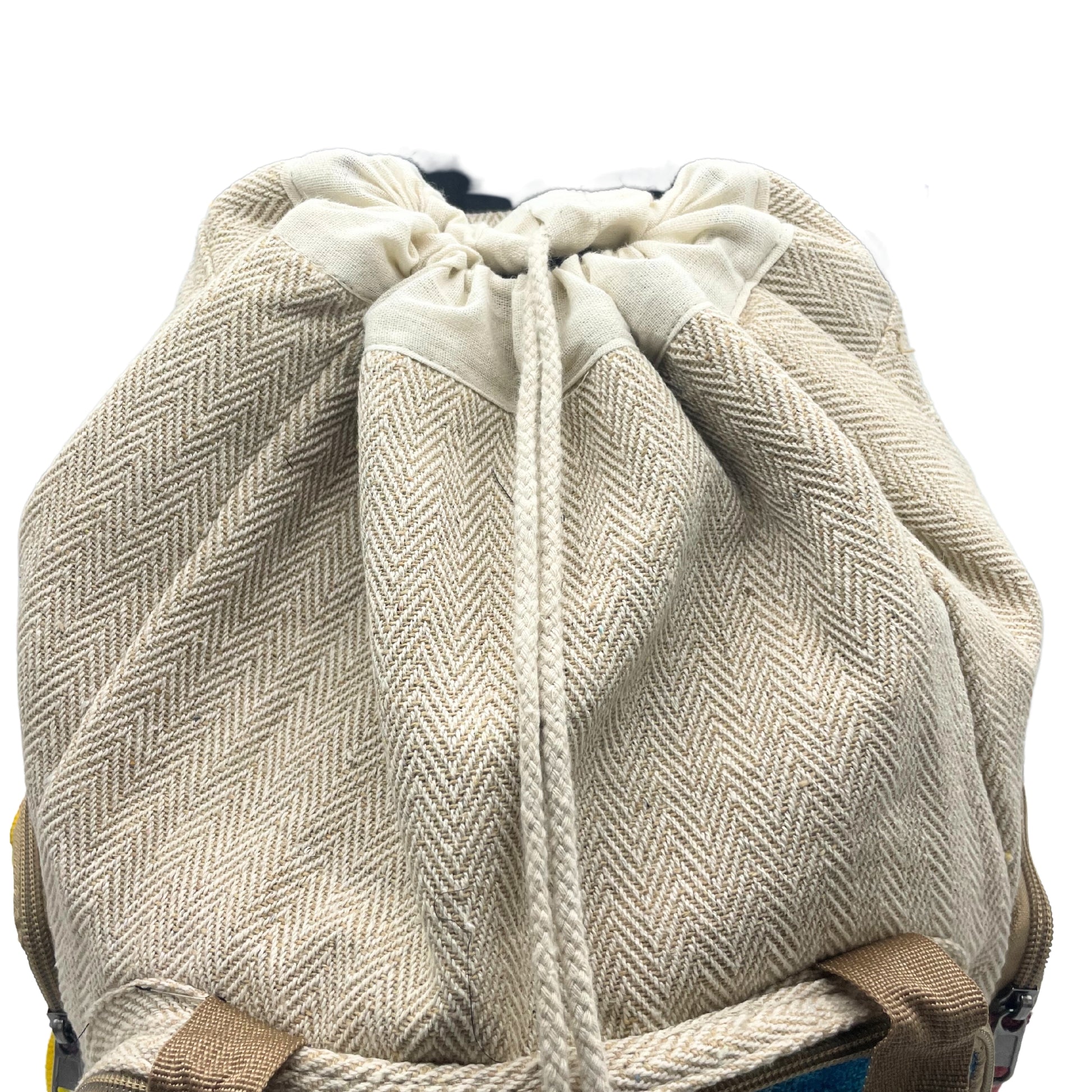 Beige herringbone patterned drawstring bag on a white background
