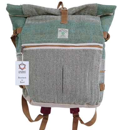 Green and gray patterned backpack with brown straps on a white background