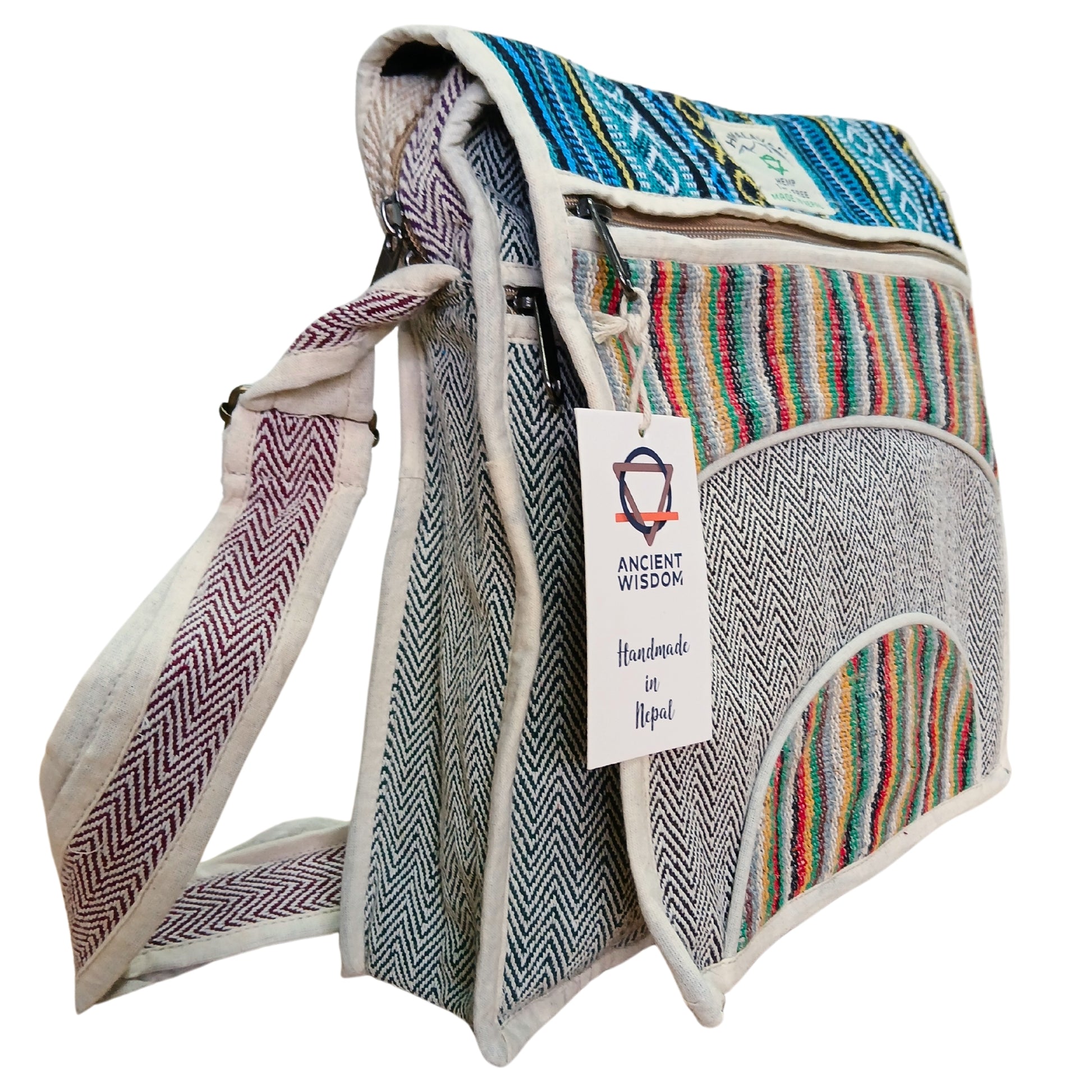 Colorful bag with patterned strap and label on a white background